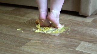 Fat legs bare feet mercilessly trampled banana and raw eggs. Crush Fetish.