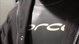 jerking off in hotel hall in wetsuit and trench coat