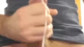 Young guy jacking off and spraying thick cum