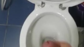 Spraying the bathroom floor.