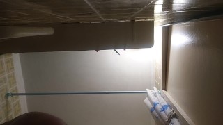 Self-made strap-on in bathroom