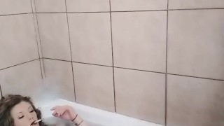 Roxy takes a smokey bubble bath wearing clothes smoking wet