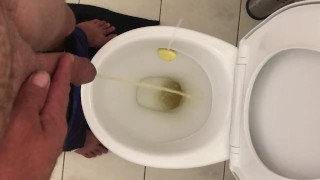 Pissing in toilet