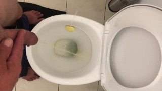 Pissing in toilet