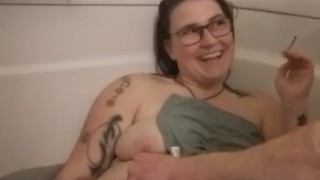 Smiley milkymama gets groomed by a fan in bathtub