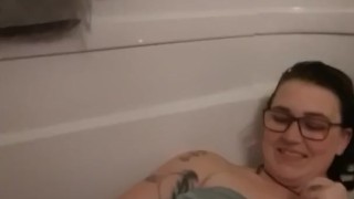 Smiley milkymama gets groomed by a fan in bathtub