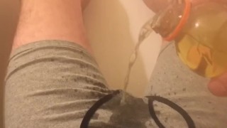 Master pouring piss on his hard cock