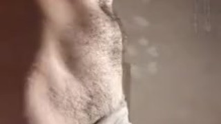 Standing, undressing and pulling cock Fire Boy