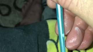 Trying to stuff little penis hole with paint brush