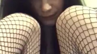 Young slut teases herself with vibrator in fishnets