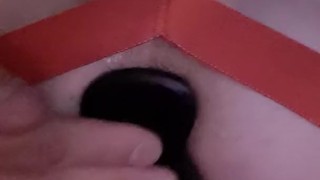 Ass being stuffed with a buttplug