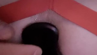 Ass being stuffed with a buttplug