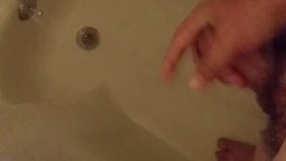 Beating off and washing my cock in the shower
