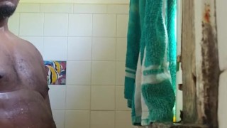 In the shower playing with my thick black cock