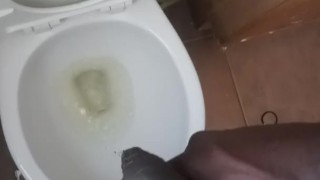 Pissing on hand and floor at work