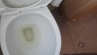 Pissing on hand and floor at work