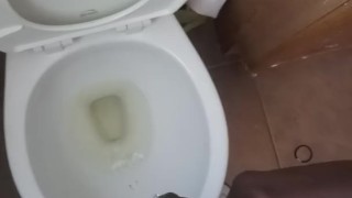 Pissing on hand and floor at work