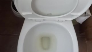 Pissing on hand and floor at work