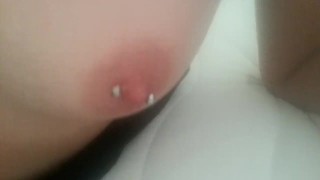Play with my pierced nipples with silver vibrator