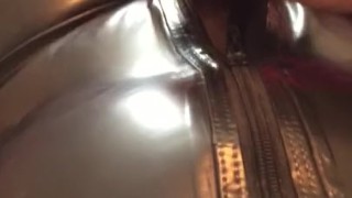 Man In Latex Catsuit Rubbing Cock With Satin Sheets