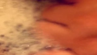 Playing with my pussy on a bubble bath