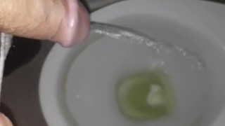 Boy pissing toilet