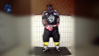 Rubber hockey pup pawing off