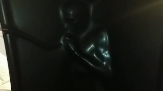 Slave encased in latex vacuum tower
