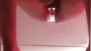 Big tits brunette masturbating on glass table