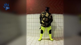 Pawing off in camo painter's overall and hi-viz waders