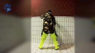 Pawing off in camo painter's overall and hi-viz waders