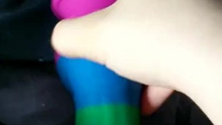 Cumming on a rainbow dildo in bed