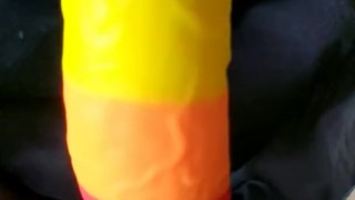 Cumming on a rainbow dildo in bed
