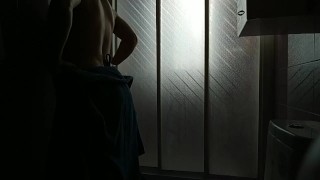 Boy performs striptease in slow motion while whipping. Produce sound waves