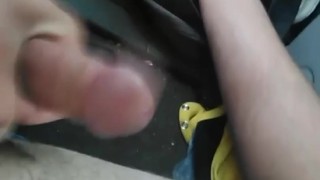In a parking lot in front of a gas station playing with my hard cock