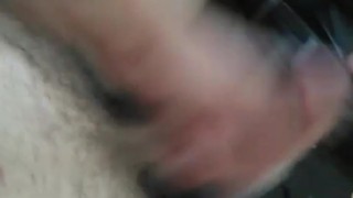 In a parking lot in front of a gas station playing with my hard cock
