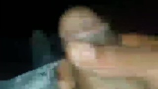 Rubbing his dick