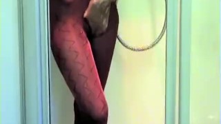 Young Babe Taking A Silky Pantyhose Nylon Encasement Shower