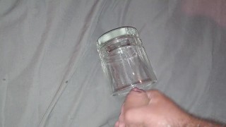 Solo masturbation cumshot into glass cup