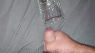 Solo masturbation cumshot into glass cup