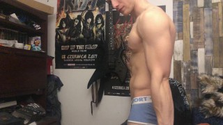 Chris Wild doing biceps curls and masturbates his big cock