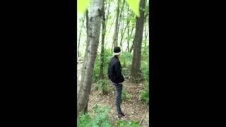 Bad boy jerks while smoking cigarette in a forest - almost caught - so his balls stay full