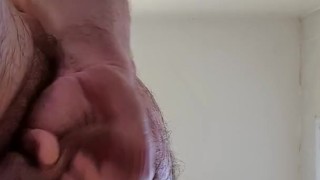 View from directly below. Jerking off still wet from the shower.