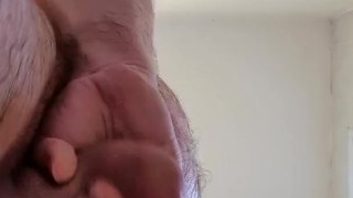 View from directly below. Jerking off still wet from the shower.