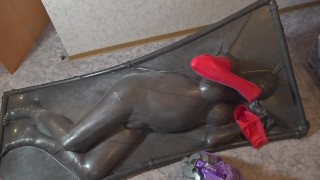 Session with Mouth-feature mask dressed as doll in vacbed selfbondage
