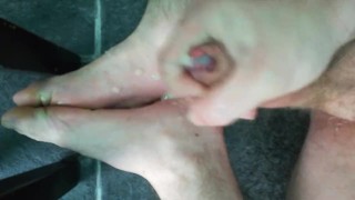 Gym fit male athlete flings spunk all over his tired feet.