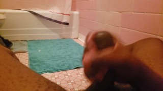In the bathroom playing with my black cock