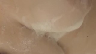 Soaping up my big tits in the shower