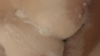 Soaping up my big tits in the shower