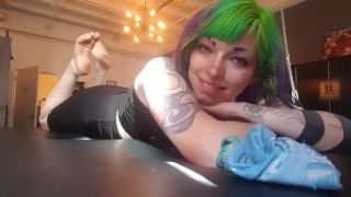 The Pose. Goth emo girl showing off dirty soles in a bdsm dungeon